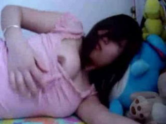 Asian Fondling Herself In Bed